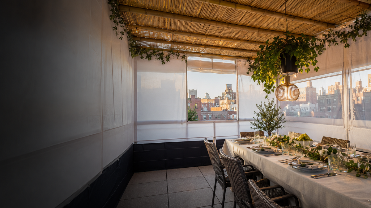 Professionally prepared rooftop sukkah with schach and a holiday table in New York